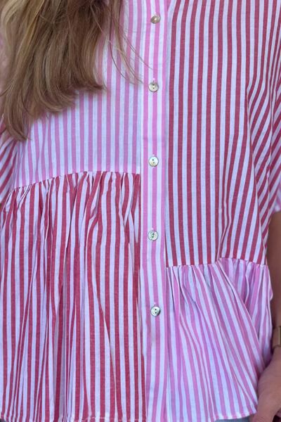 Button down striped ruffled hem shirt.