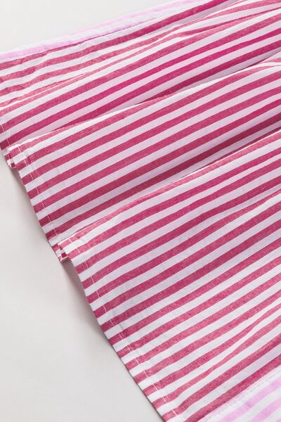 Button down striped ruffled hem shirt.