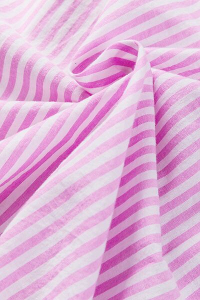 Button down striped ruffled hem shirt.