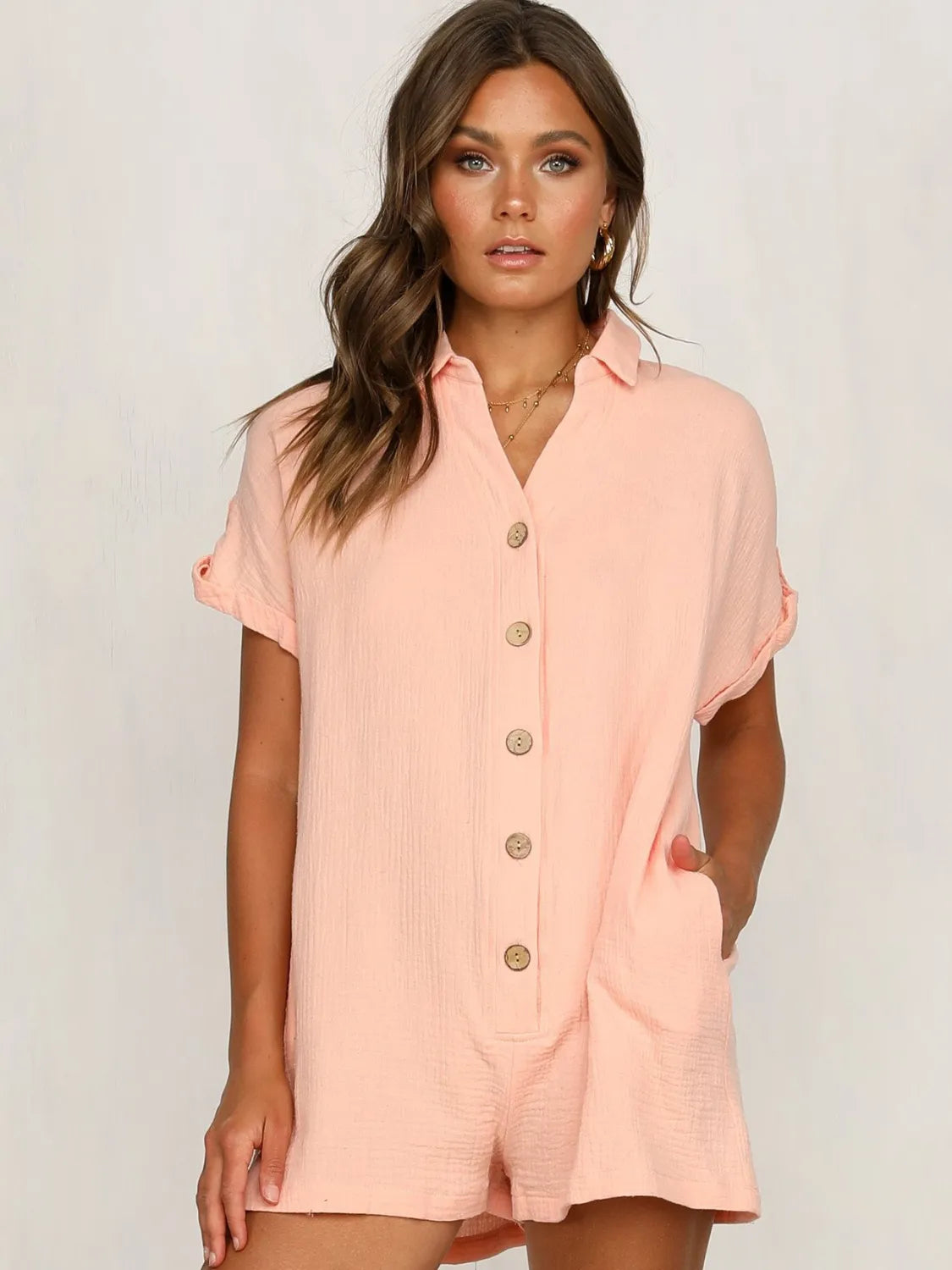 Button Front Short Sleeve Romper with Pockets.
