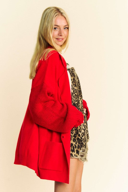 Button up dropped shoulder cable-knit cardigan with pockets.