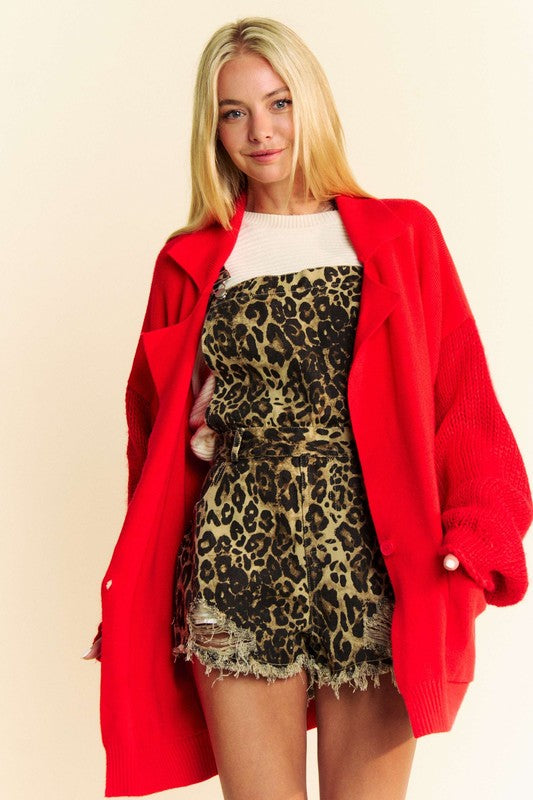 Button up dropped shoulder cable-knit cardigan with pockets.