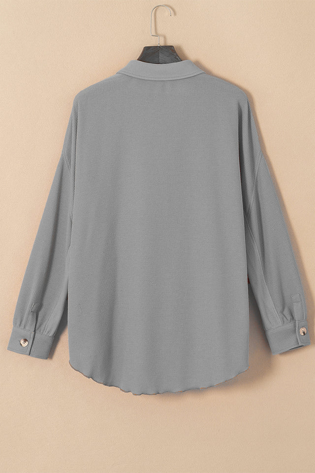 Button up long sleeve shirt.