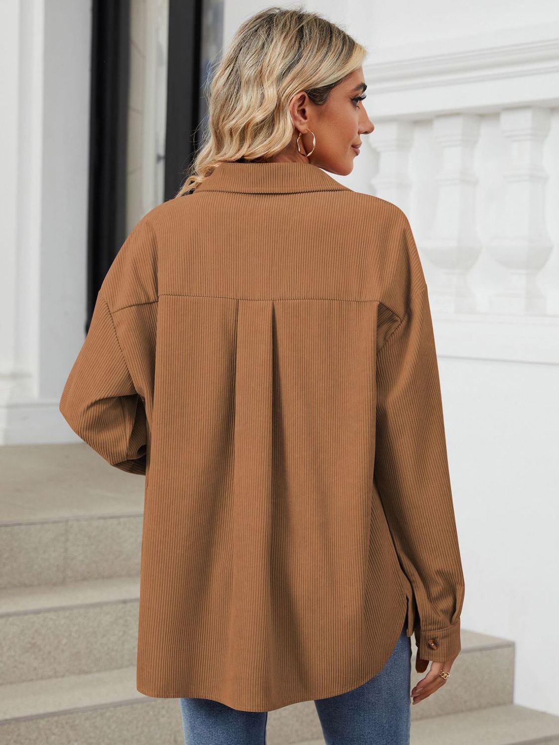 Button up long sleeve shirt with breast pockets.