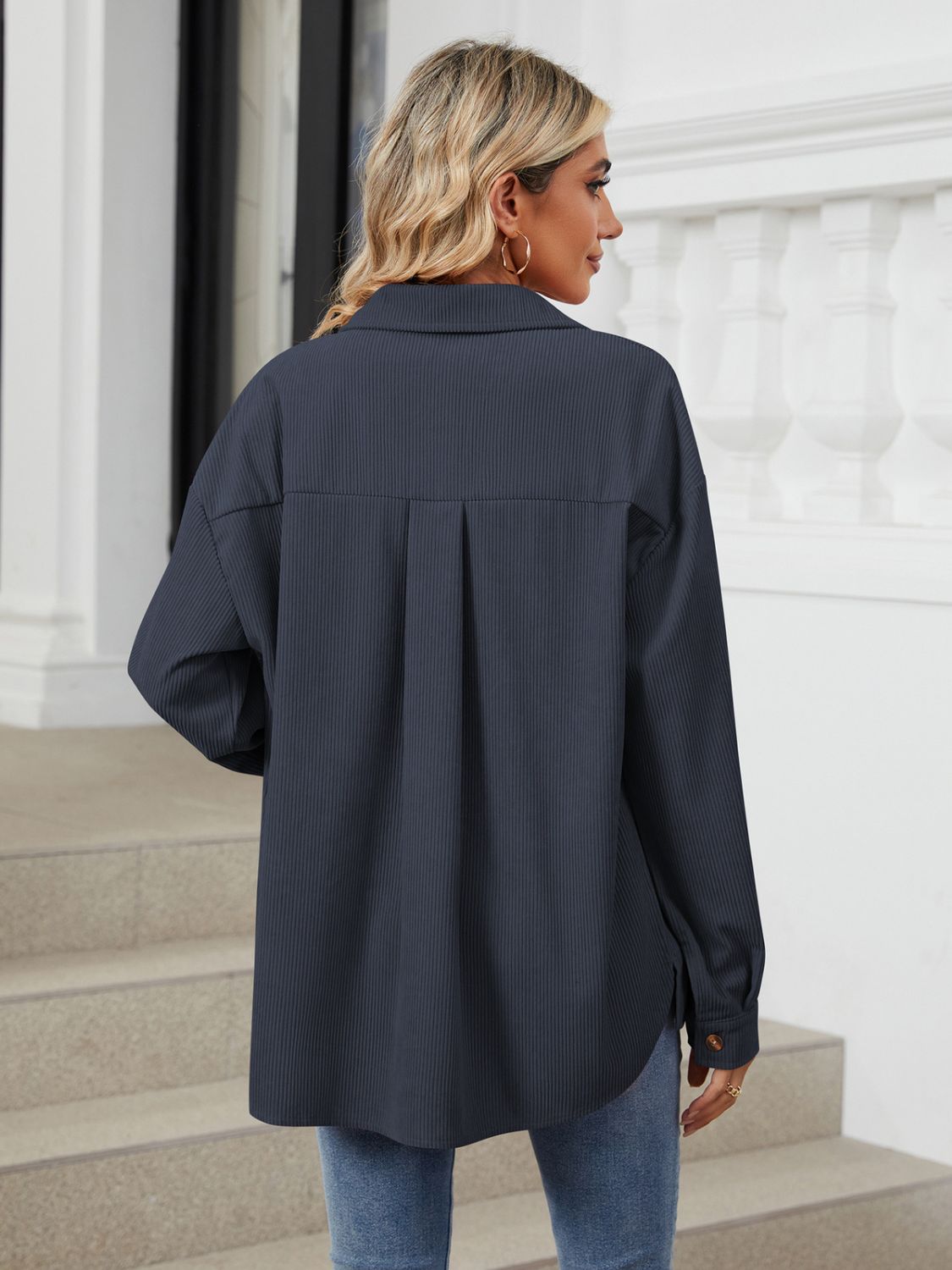 Button up long sleeve shirt with breast pockets.