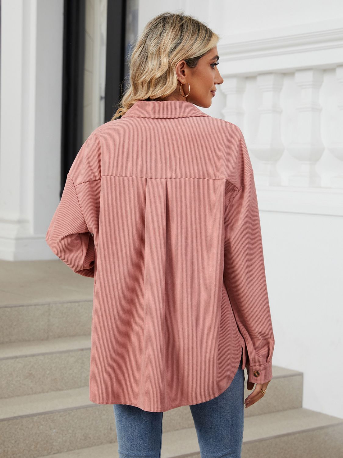 Button up long sleeve shirt with breast pockets.