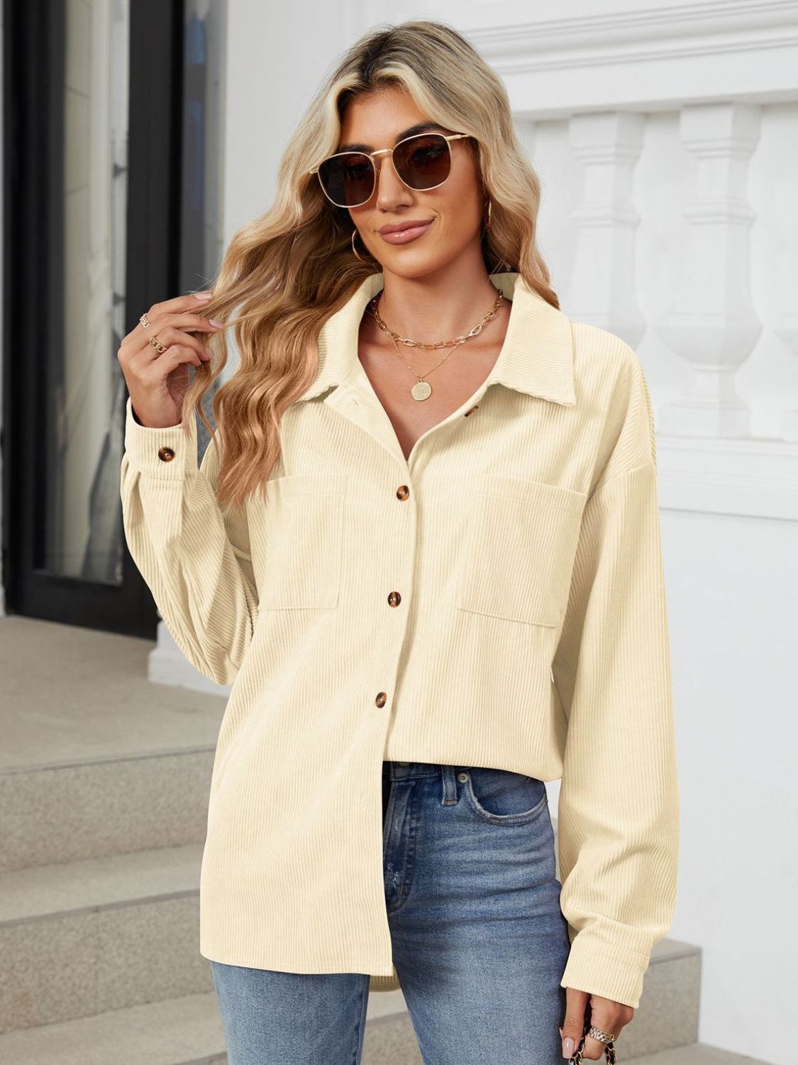Button up long sleeve shirt with breast pockets.