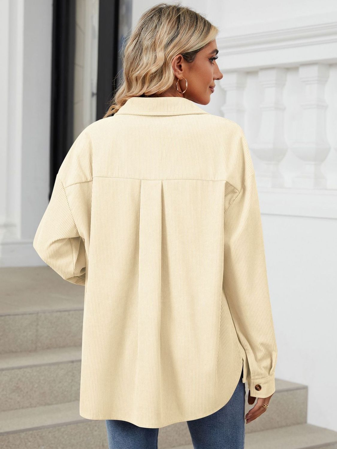 Button up long sleeve shirt with breast pockets.