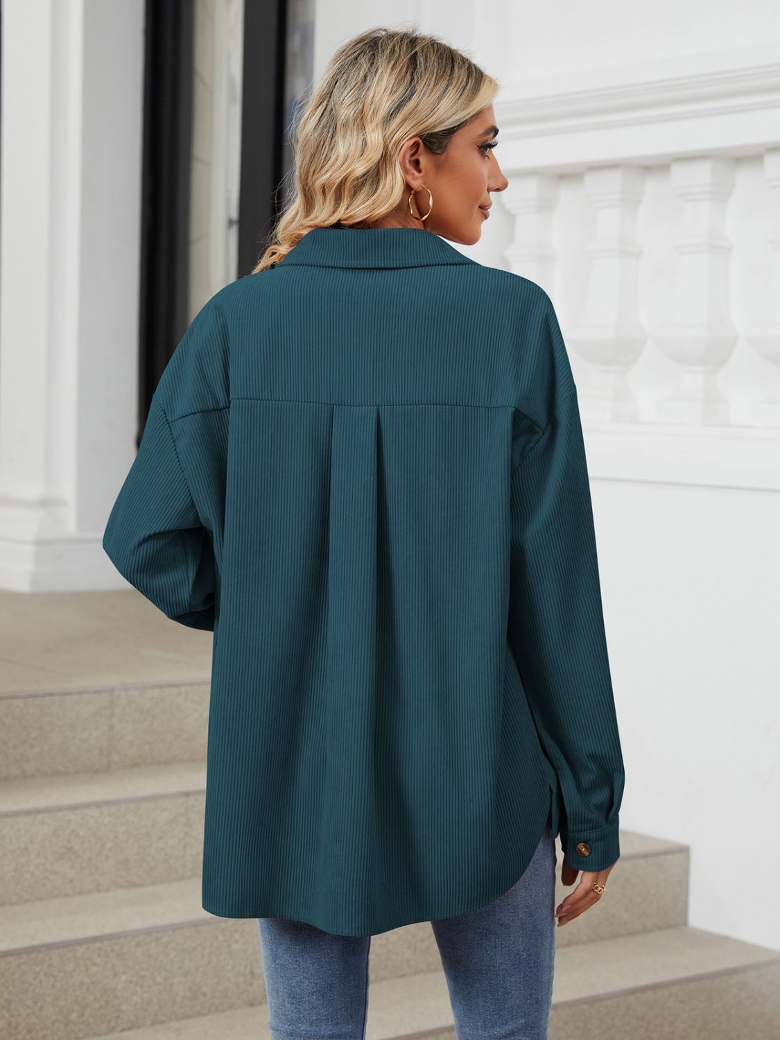 Button up long sleeve shirt with breast pockets.