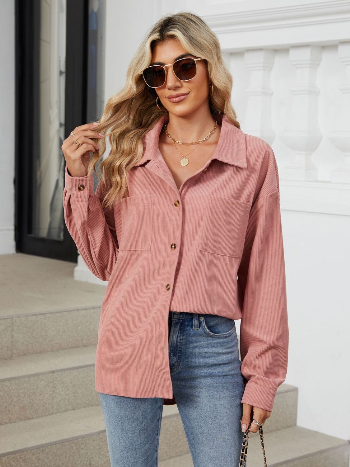 Button up long sleeve shirt with breast pockets.