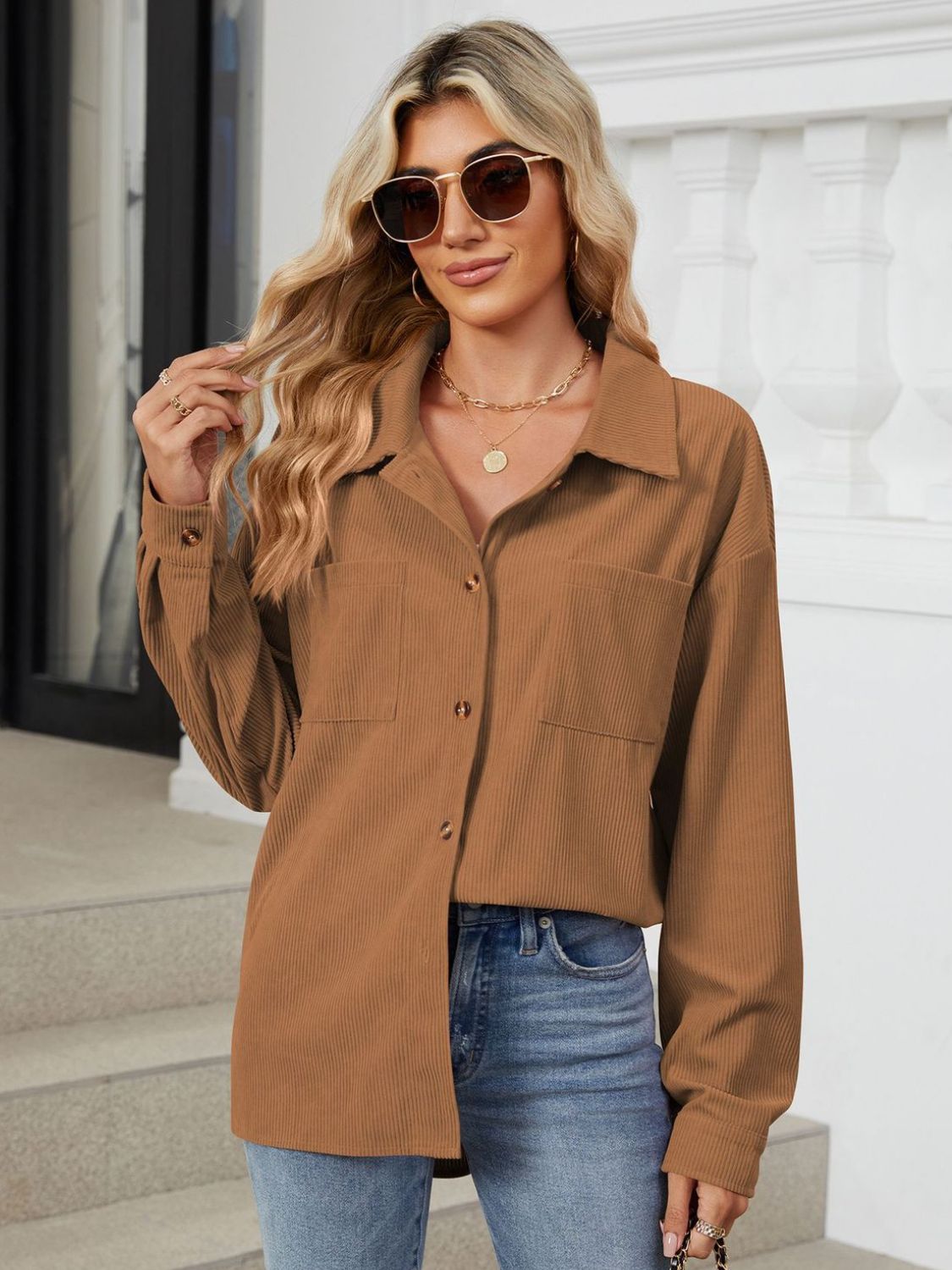 Button up long sleeve shirt with breast pockets.