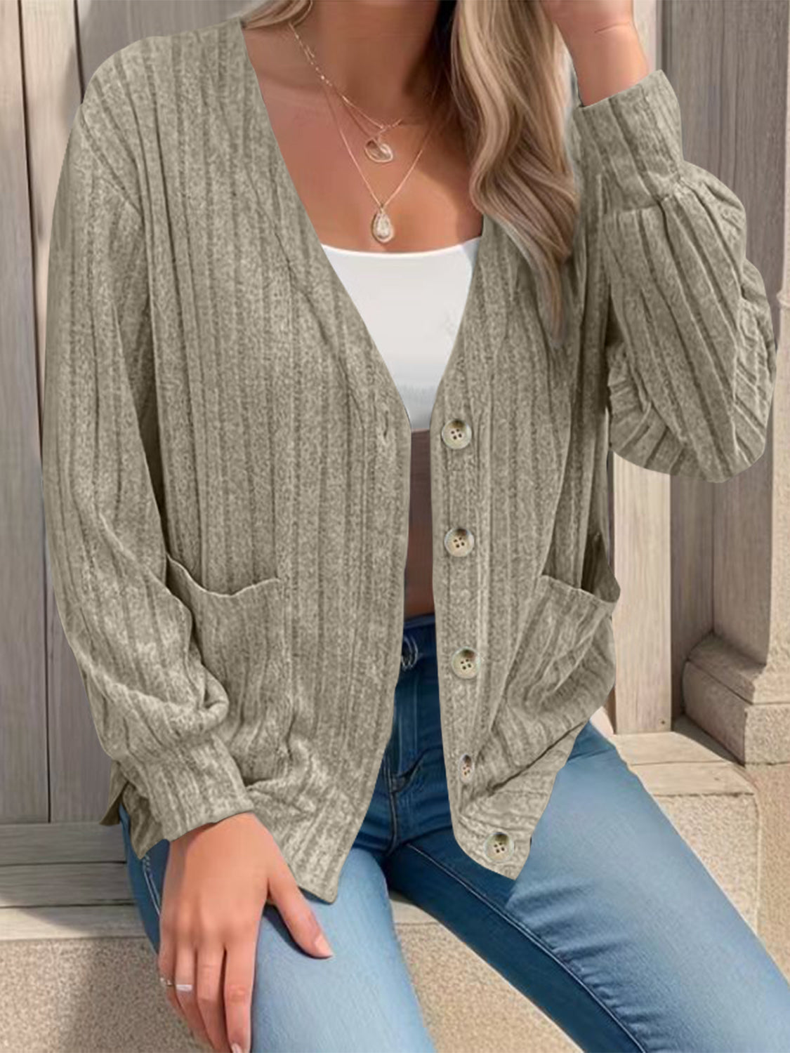 Full size button up V-neck long sleeve cardigan with pockets.