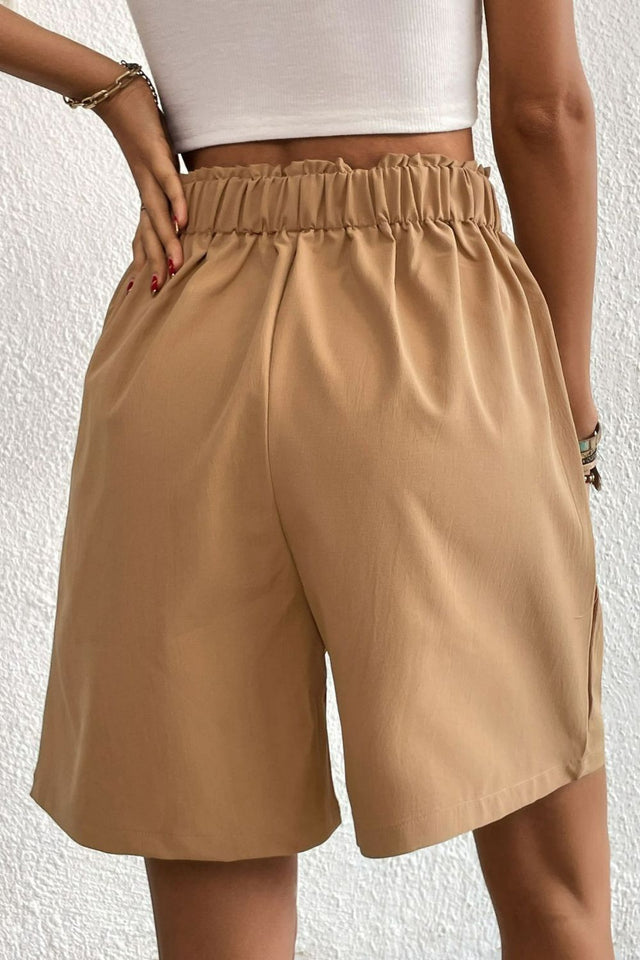 Buttoned elastic waist pleated detail shorts.