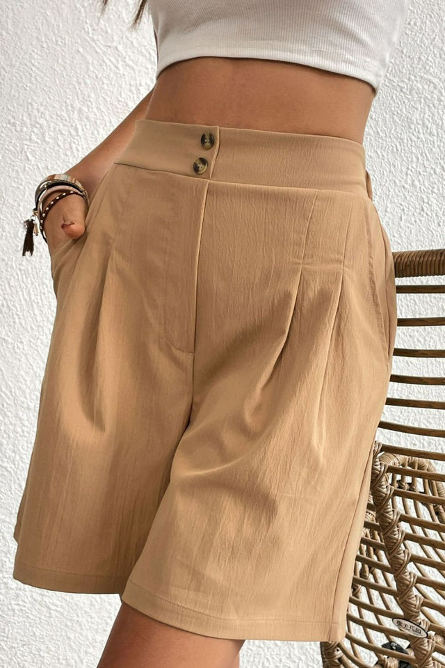Buttoned elastic waist pleated detail shorts.