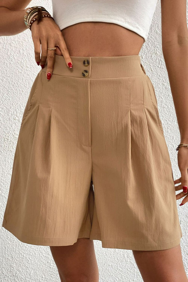 Buttoned elastic waist pleated detail shorts.