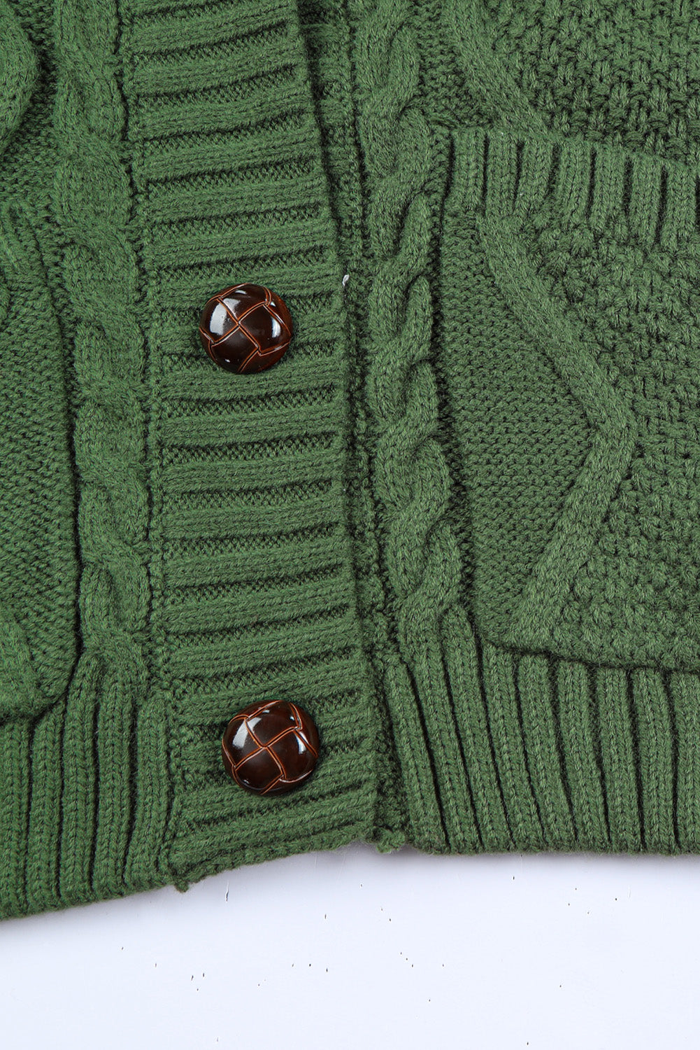 Cable-knit button down V-neck cardigan with pockets.