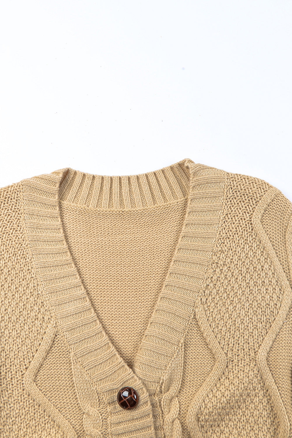 Cable-knit button down V-neck cardigan with pockets.