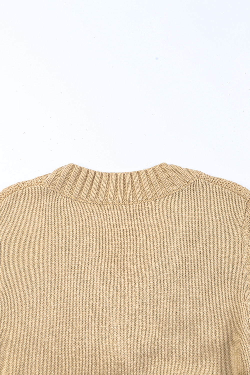 Cable-knit button down V-neck cardigan with pockets.