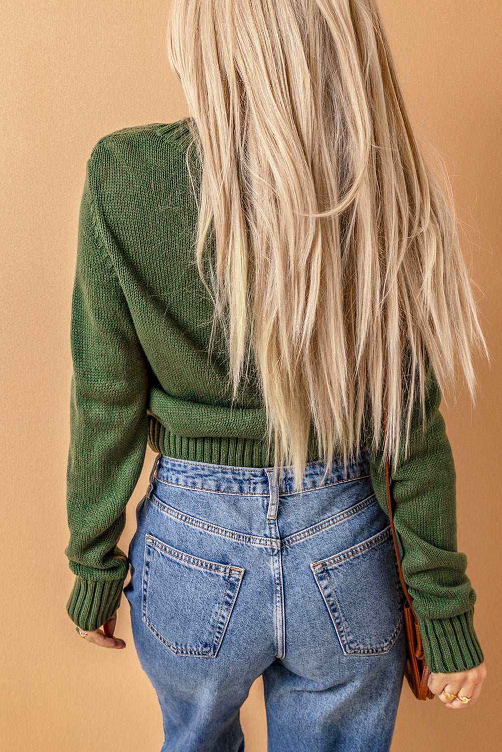 Cable-knit button down V-neck cardigan with pockets.