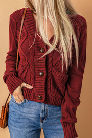 Cable-knit button down V-neck cardigan with pockets.