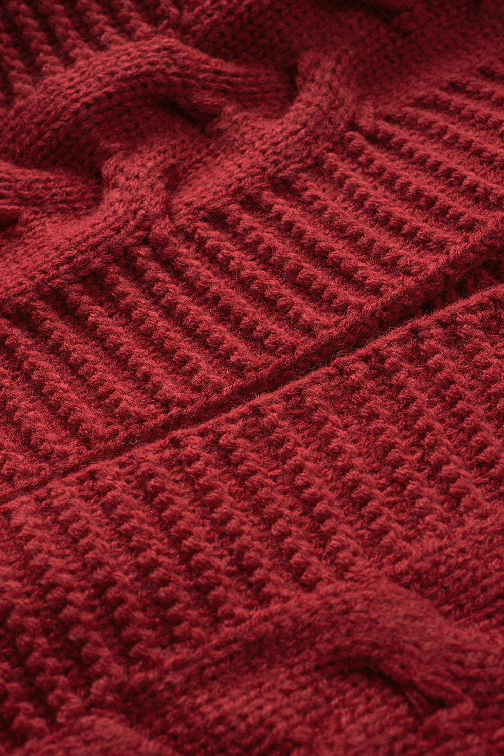 Cable-knit open front cardigan.