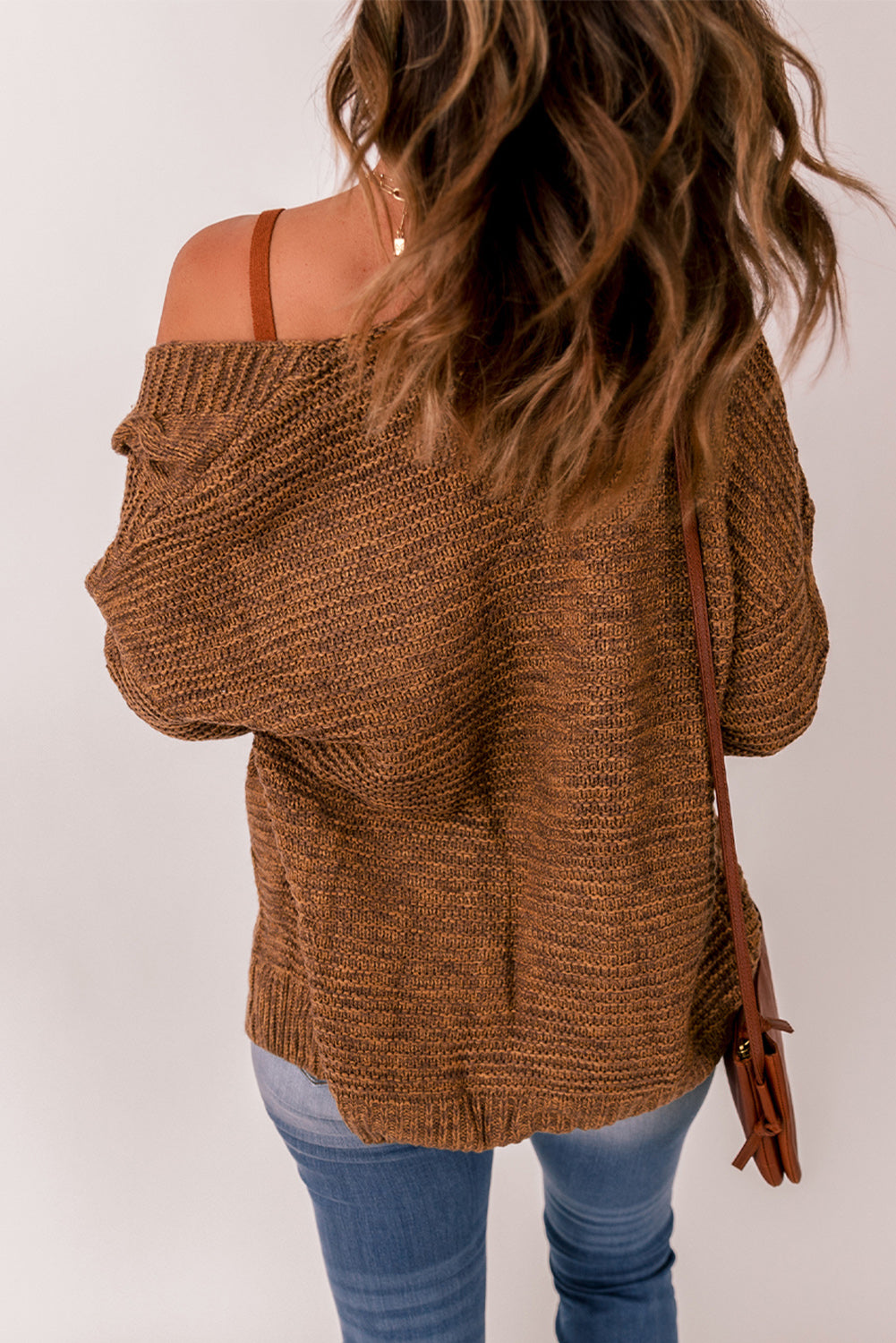 Cable-knit open front cardigan.