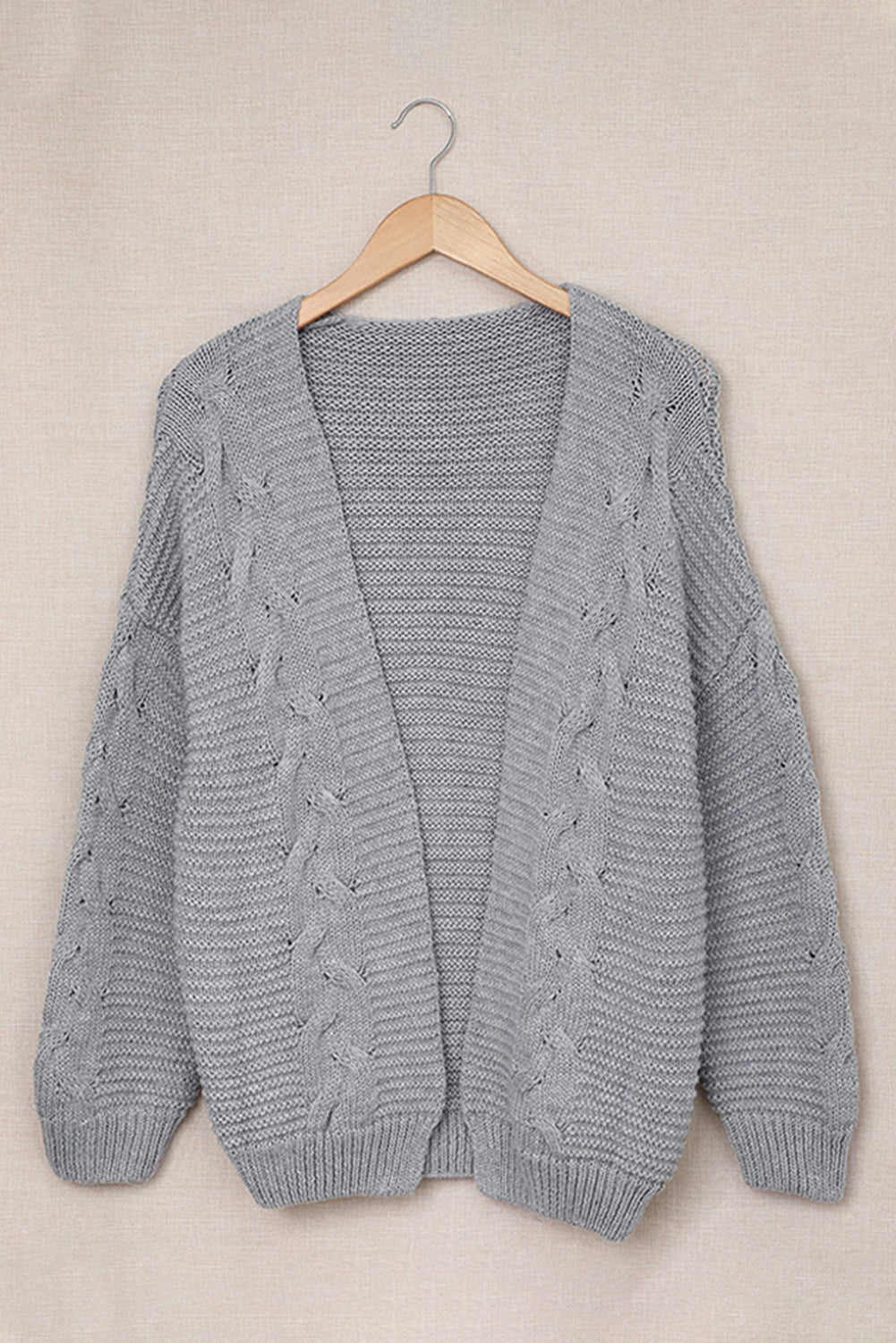 Cable-knit open front cardigan.