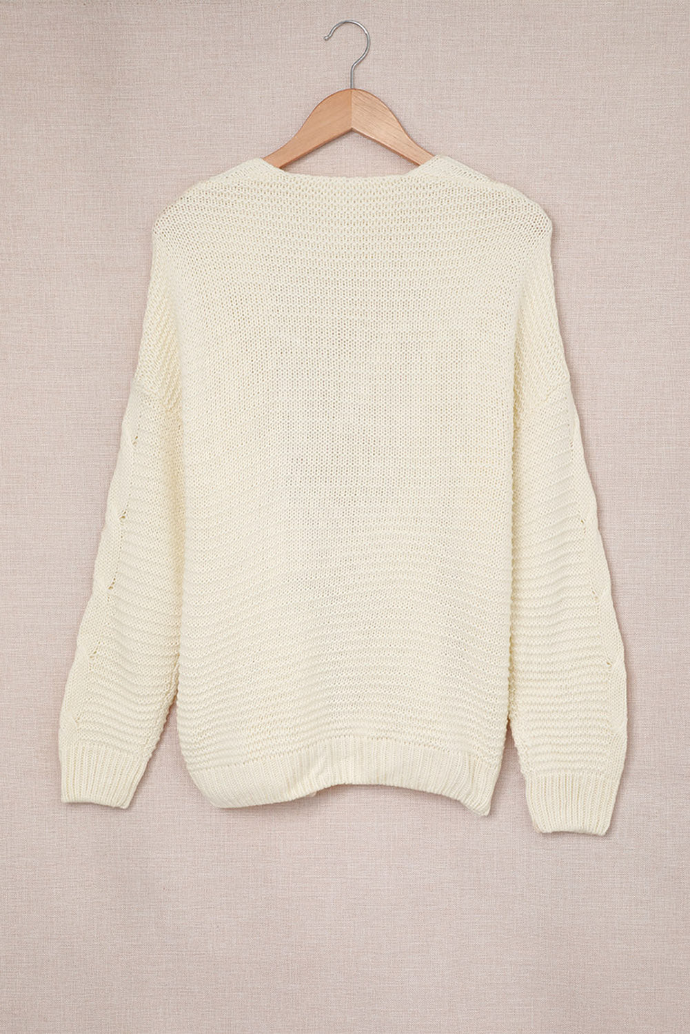 Cable-knit open front cardigan.