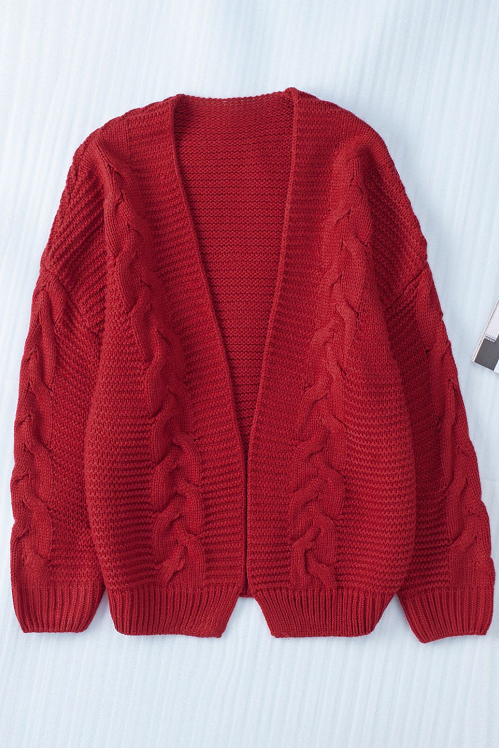 Cable-knit open front cardigan.