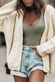 Cable-knit open front cardigan.