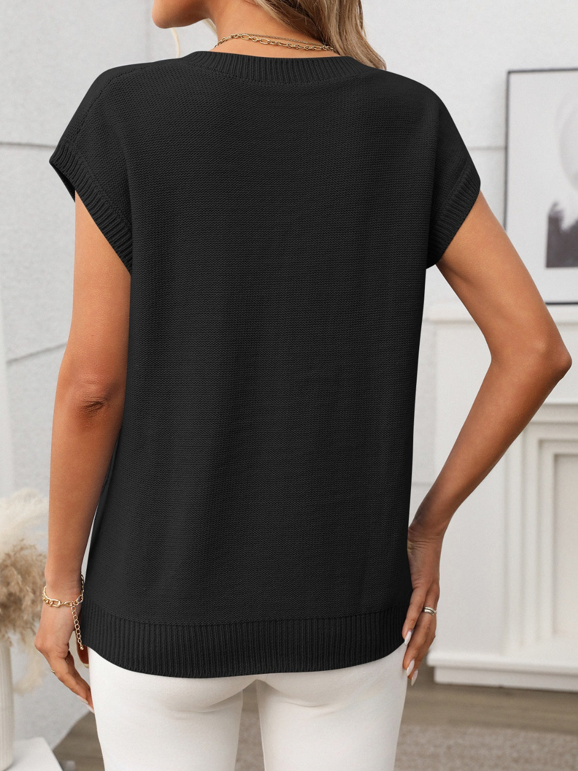 Cable-knit V-neck short sleeve knit top.