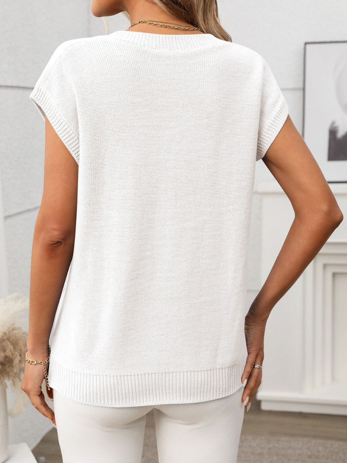 Cable-knit V-neck short sleeve knit top.
