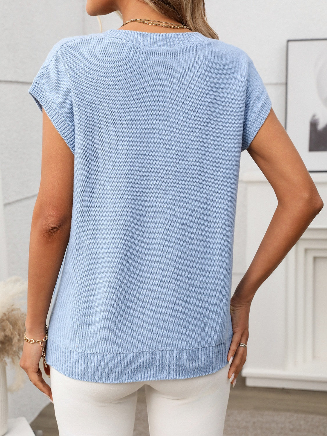 Cable-knit V-neck short sleeve knit top.