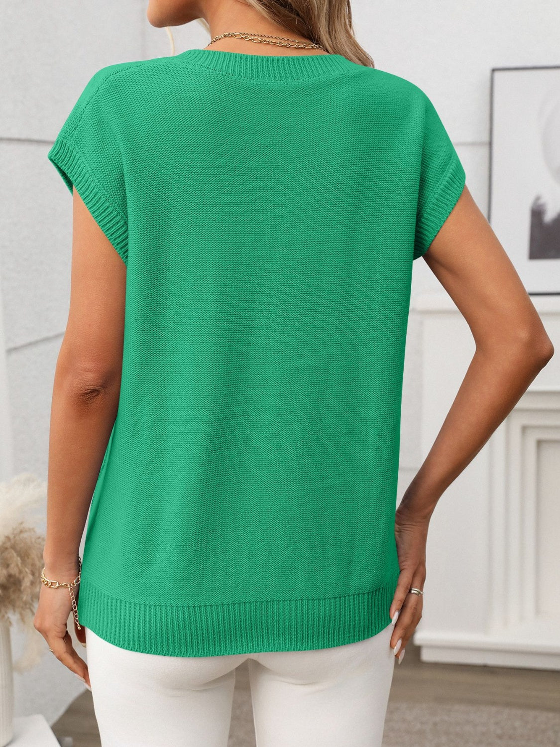 Cable-knit V-neck short sleeve knit top.