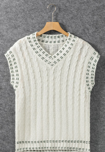 Cable-knit V-neck sweater vest.
