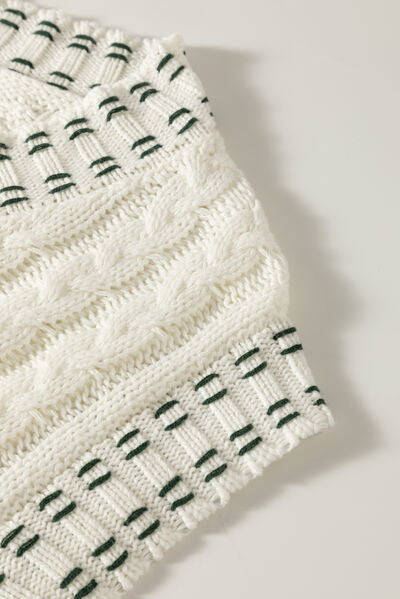 Cable-knit V-neck sweater vest.