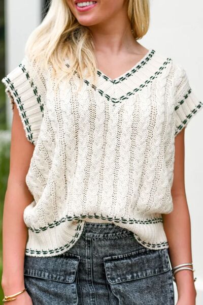 Cable-knit V-neck sweater vest.