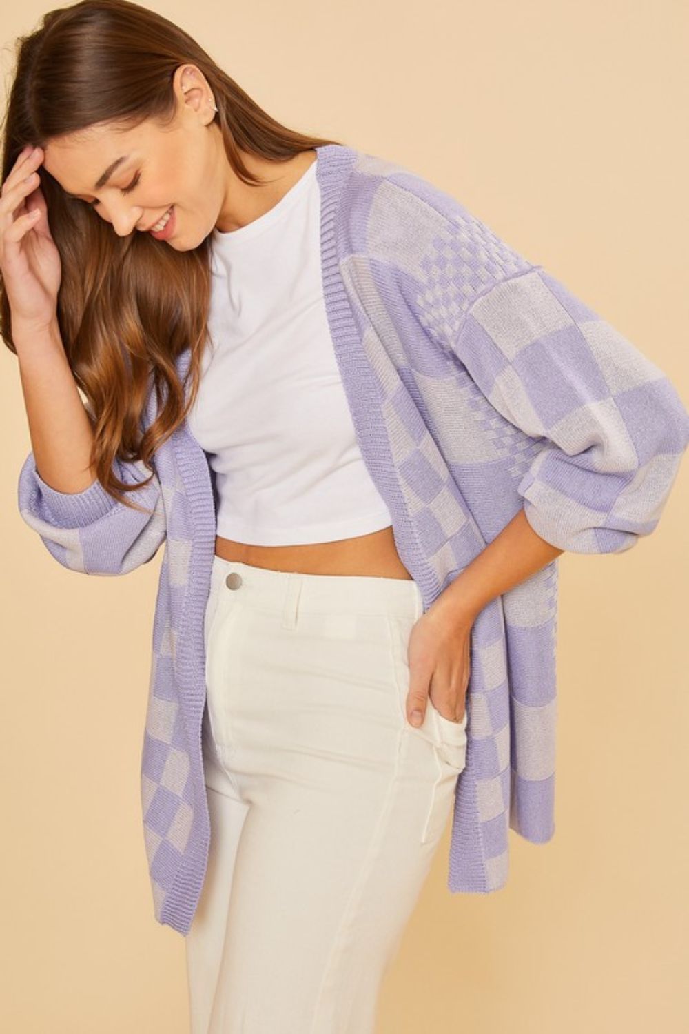 Checkered open front drop shoulder cardigan with ribbed details.