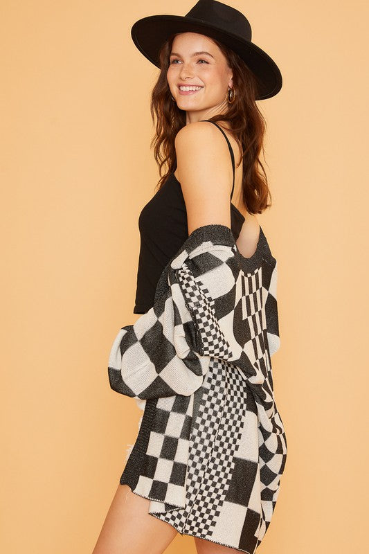 Checkered open front drop shoulder cardigan with ribbed details.