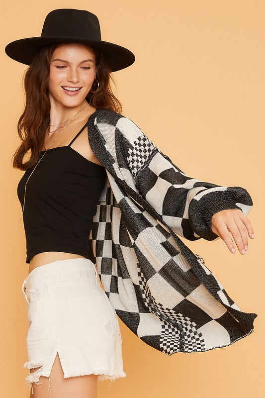 Checkered open front drop shoulder cardigan with ribbed details.