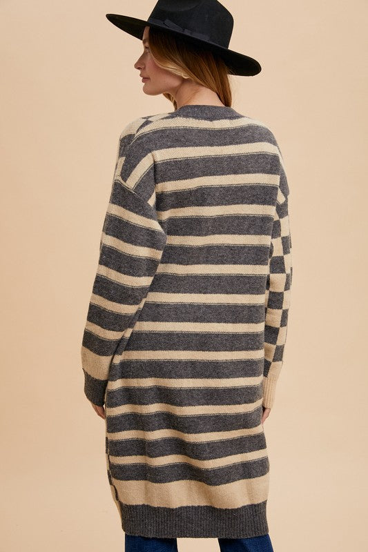 Checkered and striped open front long sleeve cardigan with ribbed pockets.