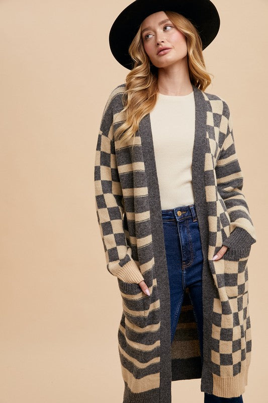 Checkered and striped open front long sleeve cardigan with ribbed pockets.