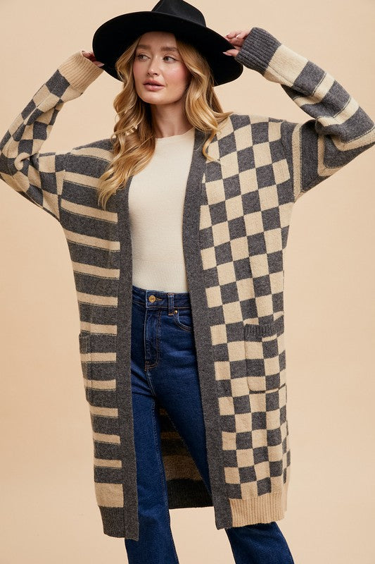 Checkered and striped open front long sleeve cardigan with ribbed pockets.