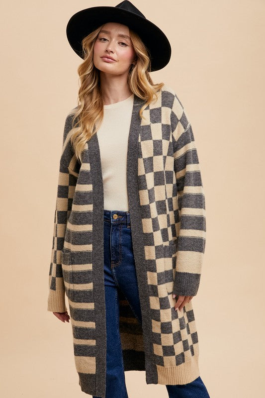 Checkered and striped open front long sleeve cardigan with ribbed pockets.