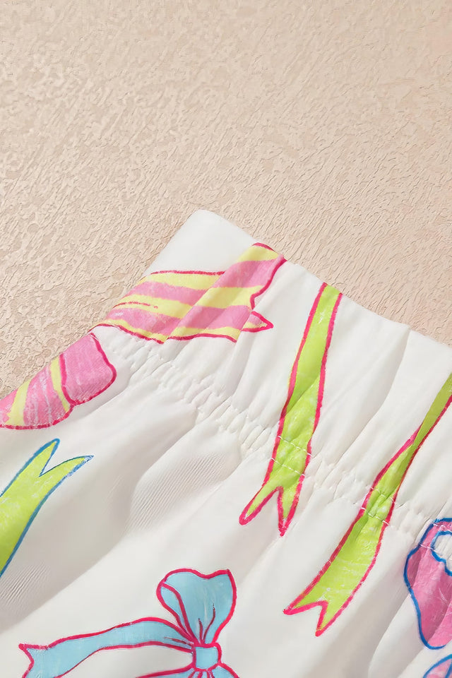 Women's cheerful bow print elastic pull-on casual shorts.