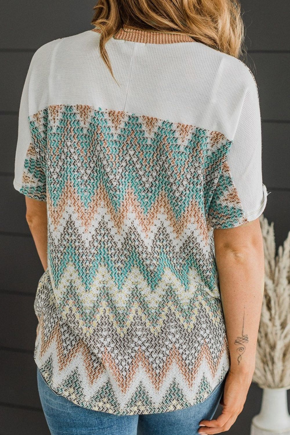 Chevron patchwork raglan sleeve knit top.
