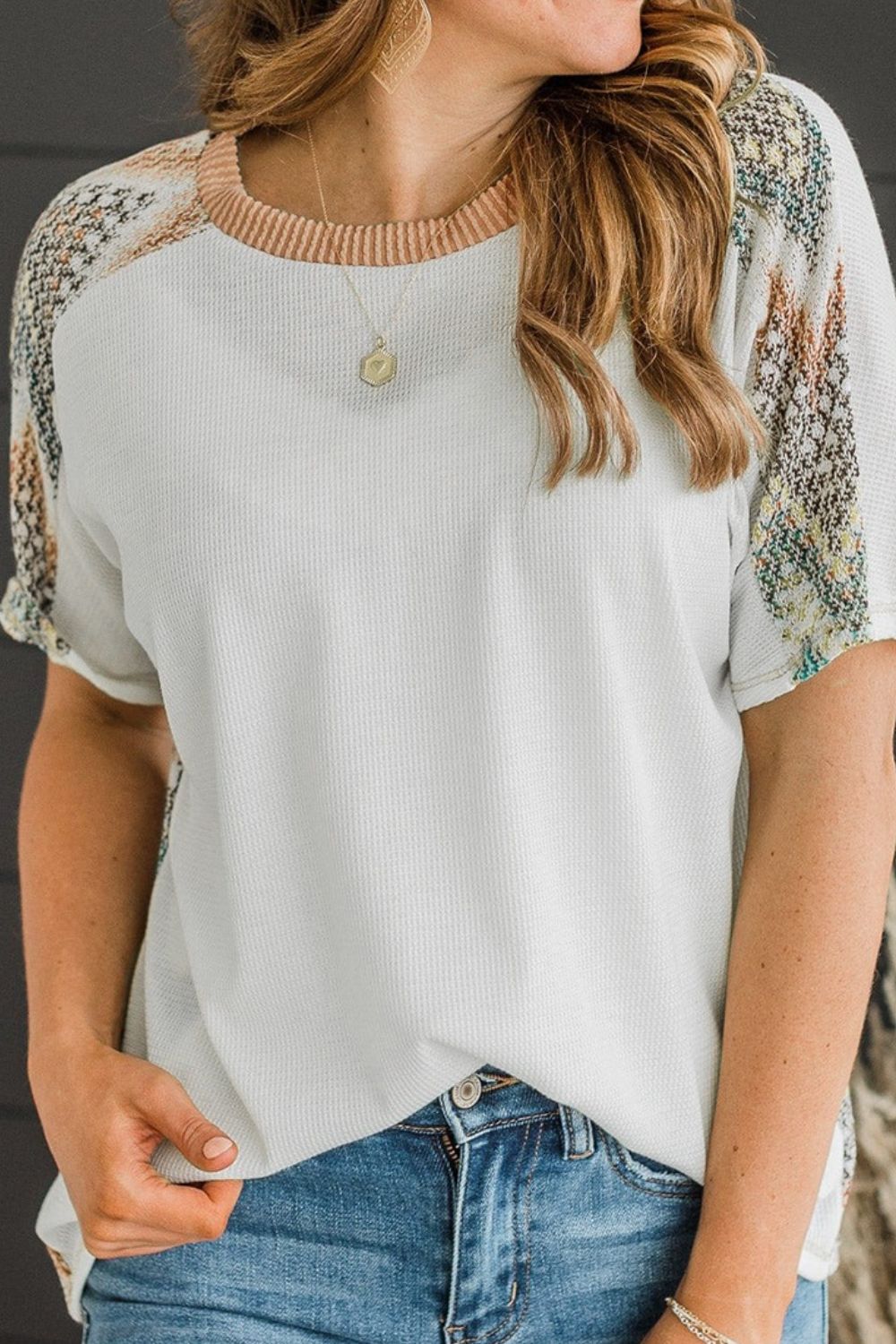 Chevron patchwork raglan sleeve knit top.