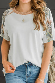 Chevron patchwork raglan sleeve knit top.