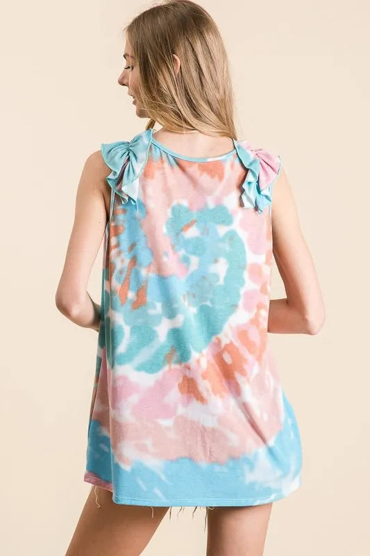 Circular tie dye knit V-neck top with ruffle details.