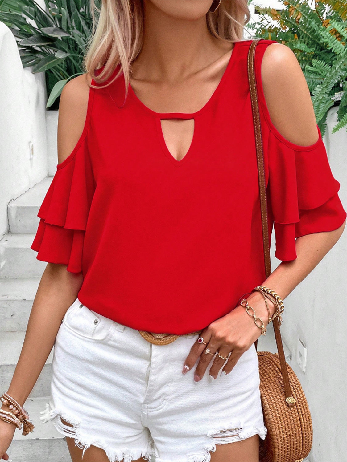 Cold shoulder flounce sleeve blouse with ruffles.